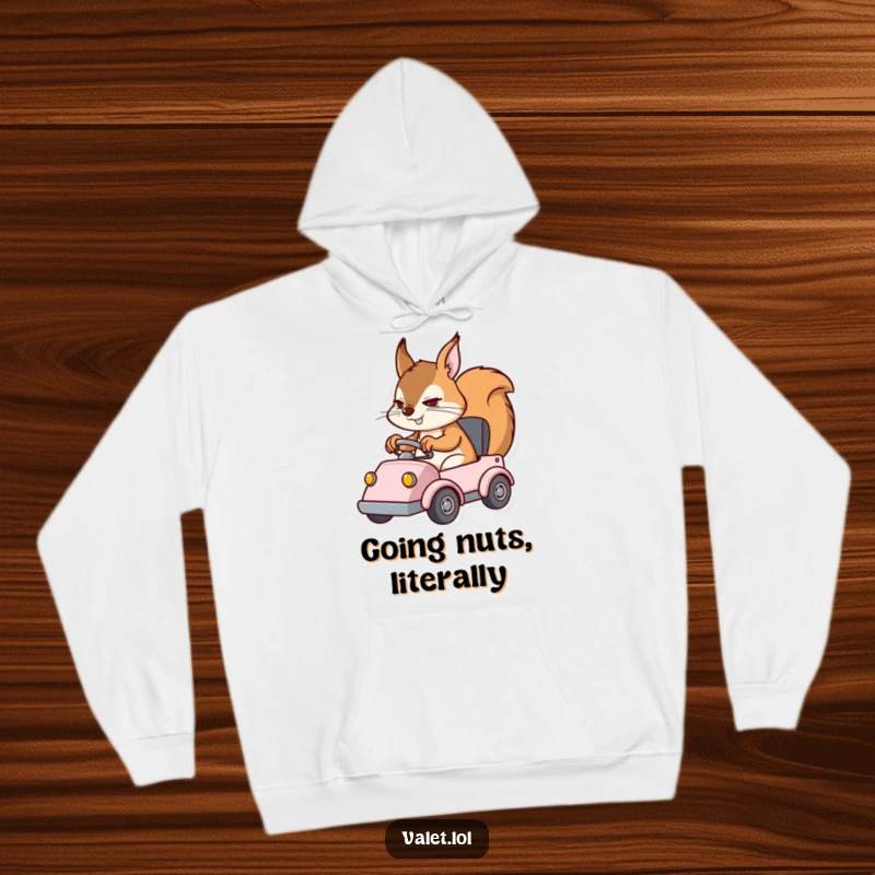 Funny hoodie depicting a determined squirrel character expertly operating a small vehicle, providing warmth and a chuckle.